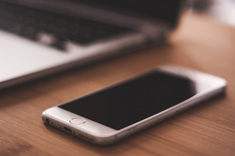 SmartPhone on Desk - Book a consultation with Visual Filmworks - Video Production Company Chicago